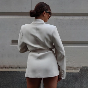 Chic cream white slim-fit blazer with waist belt and button sleeve detail, back view