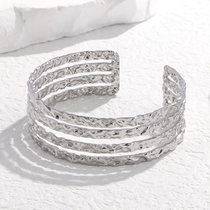 Irregular hammered lava texture multi-layer open bangle in polished silver stainless steel