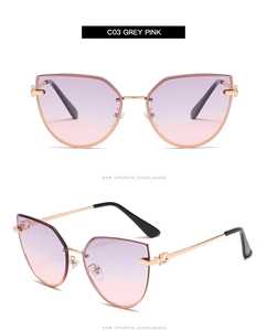 Detail of grey-pink gradient cat-eye sunglasses with golden metal Gancini hinges