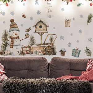 Christmas snowman and gift box wall decals shown in a cozy living room background