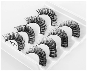 Macro detail of 6 pairs of thick curly black false eyelashes in model 4009 tray