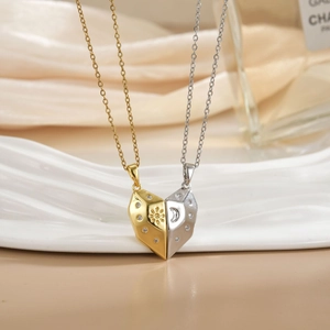 Detailed close-up of magnetic sun and moon heart necklaces with pavé zircon settings