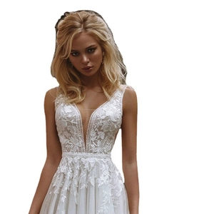 Elegant French deep V-neck bridal gown with floral lace embroidery and tulle skirt