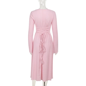 Back view detail of pink long sleeve dress showing elegant lace-up cross tie design