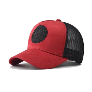Detail of red suede front and black breathable mesh back on this stylish trucker hat