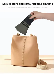 Foldable army green sun hat being stored in a beige bag showing its portable design
