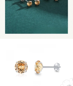 Macro detail of S925 sterling silver stamp on yellow zircon stud earrings with prong setting