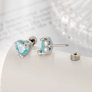Silver star heart stud earrings with blue zircon and shell texture details