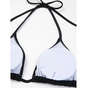 Detailed close-up of bikini top with white mesh lining and black halter straps stitching