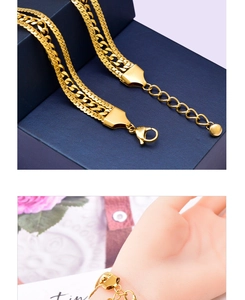 Detailed view of triple-layered golden flat snake chain bracelet with adjustable lobster clasp