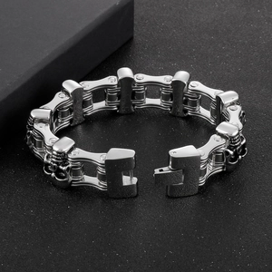 Macro shot of stainless steel skeleton motorcycle bracelet with mechanical chain links