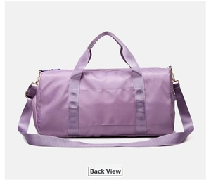 Rear view of purple waterproof travel bag featuring large zipper pocket and adjustable strap