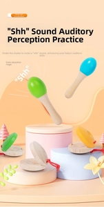 Macro detail of wooden musical instruments including castanets and sand hammers on stands