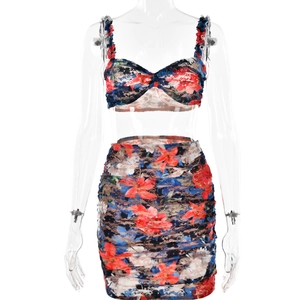 Detail of floral lace two-piece set with cropped camisole top and bodycon mini skirt