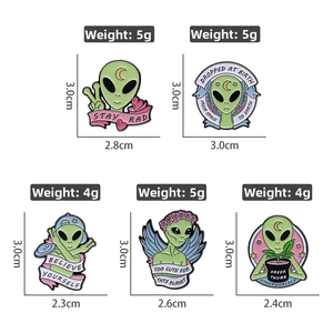 Detailed size chart for green alien enamel pins with Stay Rad and Believe Yourself quotes