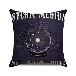 Close-up of Halloween psychic medium cushion cover with mystic print and text
