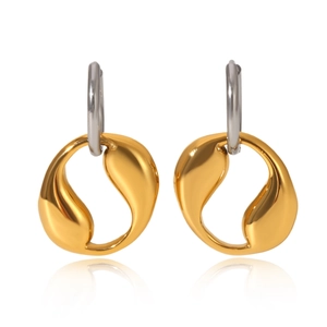 Macro view of geometric two-tone stainless steel earrings with gold sculptural pendants