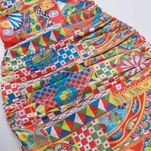 Detail of colorful Sicilian print fabric with elastic pleated smocked texture