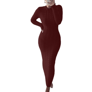 Detail of burgundy cable knit dress showing texture and slim-fit long sleeves