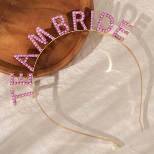 Elegant gold rhinestone headband with pink Team Bride lettering for bridal parties