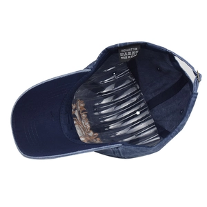 Detail view of cotton inner lining and washing label on navy blue vintage baseball cap