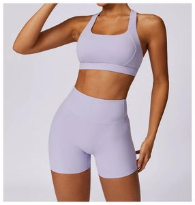 Detail of high-elastic lavender yoga set featuring seamless high-waist shorts and racerback bra