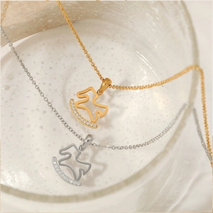 Carousel horse necklace in gold and silver finish with sparkling zircon stones