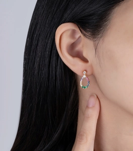 Close-up of model wearing waterdrop hollow earrings with multicolored zircon stones