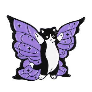 Detail of enamel pin featuring a wizard cat with purple butterfly wings and star accents