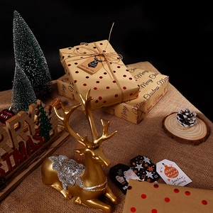 Christmas gift wrapping set with red polka dots kraft paper, tags and jute twine
