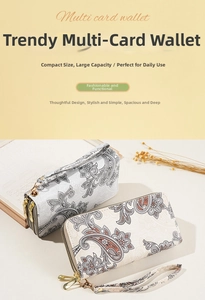 Close-up of vintage paisley print wallet with dual zipper compartments and wrist strap
