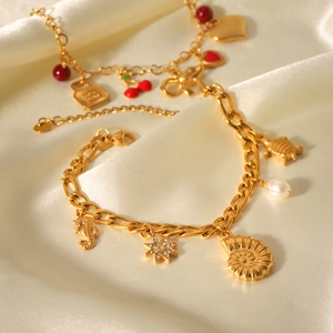 Golden stainless steel charm bracelets with sea elements and heart cherry pendants on silk