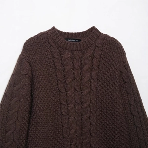 Brown cable knit sweater with chunky twist patterns and cozy crew neck design