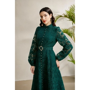 Elegant emerald green lace dress with mandarin collar and lantern sleeves in full view