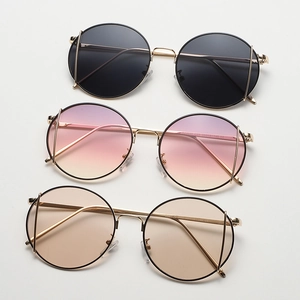 Retro round metal sunglasses for men and women with slim frames and assorted color lenses