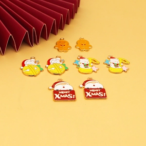 Detail of colorful enamel Christmas charms including Santa and gingerbread man with hooks