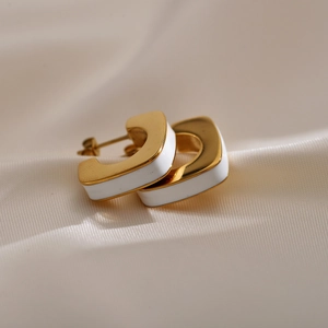 Minimalist geometric C-shaped gold-plated hoop earrings with white enamel finish
