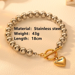 Poliertes Edelstahl-Kugelarmband mit goldenem OT-Verschluss und Herz-Anhänger