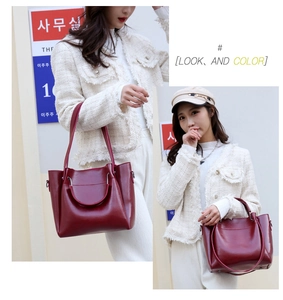 Deep burgundy glossy tote bag with large capacity and sleek top handles in close-up view