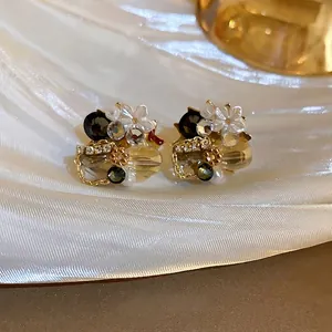Vintage floral geometric earrings with crystal rhinestones and shell petals on silk