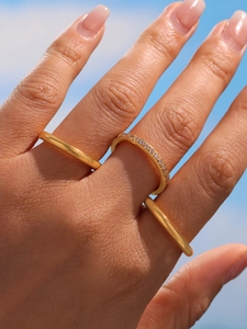 Close-up of three 18K gold plated stainless steel rings with 5A zircons on a model hand