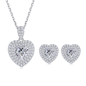 Elegant silver jewelry set featuring heart-cut moissanite necklace and matching stud earrings