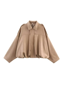 Close-up of camel brown suede texture and lapel collar on a loose bomber jacket
