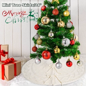 Detail of 24 inch white cable knit Christmas tree skirt with festive holiday ornaments
