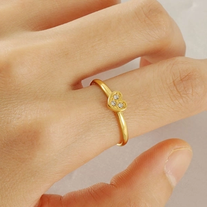Adjustable golden heart ring for women featuring three sparkling zircon stones