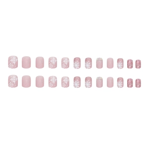 Short matte pink press-on nails with glitter ombre and snowflake rhinestones