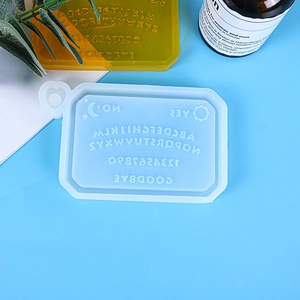 Macro view of silicone Ouija board resin mold with letters and sun moon symbols