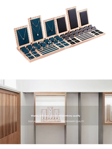 Tiered jewelry display set with wooden bases and velvet cushions for rings and necklaces