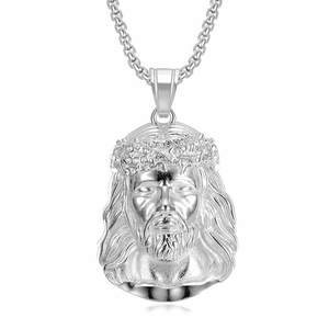 Macro detail of silver Jesus pendant with crystal crown and matte metallic finish