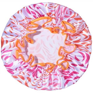Detail of waterproof satin shower cap with elastic orange trim and leaf patterns